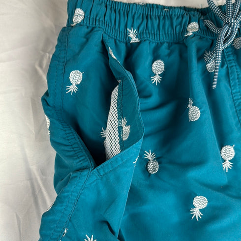 Peacock green pineapple swim shorts